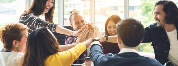 Gesture-hand-high-five-of-Group-employee-laughing-together-with-achivement-mission