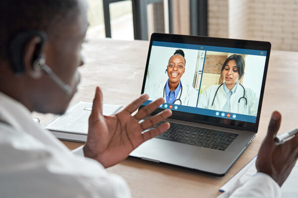 Multicultural-doctors-team-conferencing-in-video-call-chat