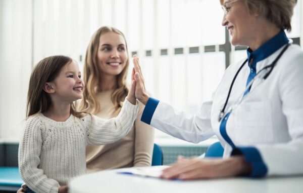 little girl high five with Doctor
